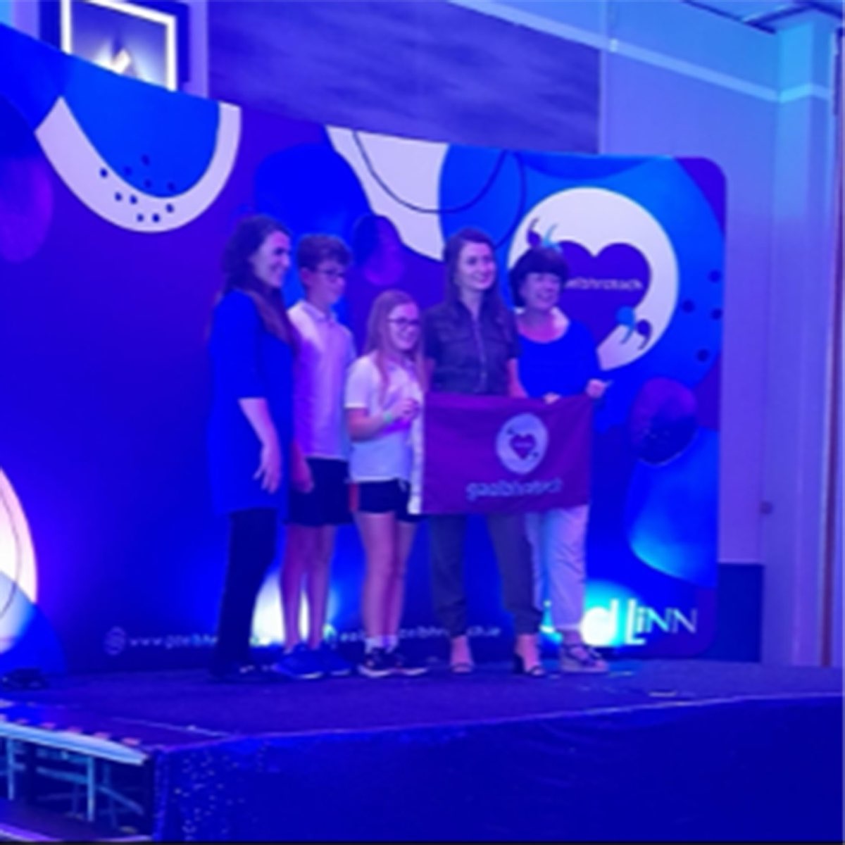 Pupils on stage receiving the Gael Bhratach award